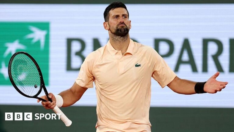 French Open 2026 results: Rusty Novak Djokovic beats Giovanni Mpetshi Perricard in four sets Novak Djokovic, wearing a peach polo shirt, holds his arms wide with his racquet in his right hand