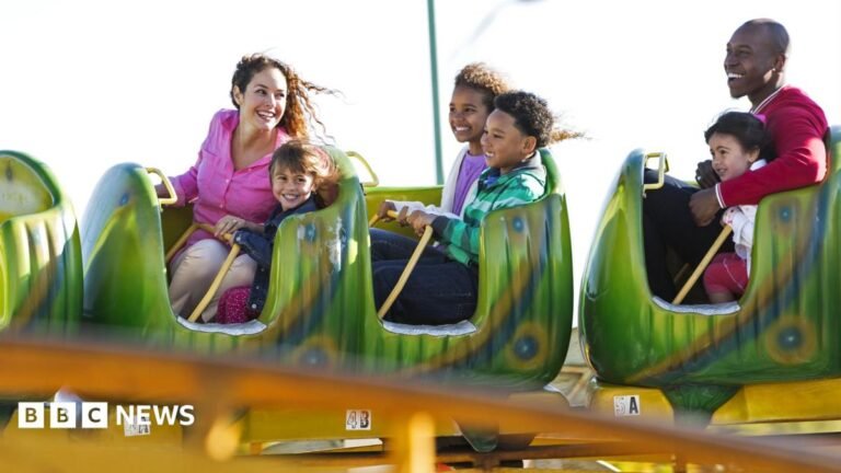 A stock image of a family enjoying a rollercoaster.