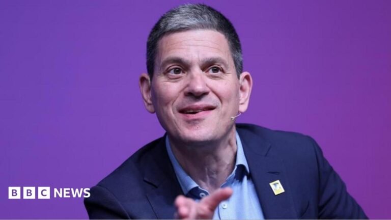 David Miliband speaking on stage