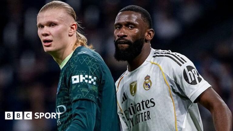 Manchester City striker Erling Haaland stands next to Real Madrid defender Antonio Rudiger during the Uefa Champions League match between the two teams at the Estadio Santiago Bernabeu