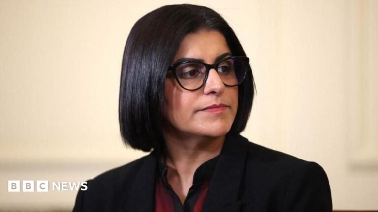 Home Office to introduce new asylum routes to UK Home Secretary Shabana Mahmood is pictured looking off camera. She is wearing a dark jacket with a red and black top on beneath.