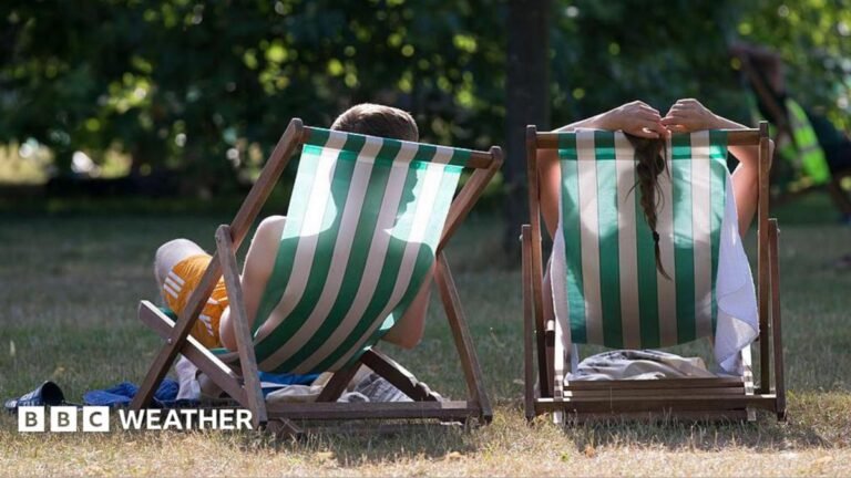 image of two people relaxing on deck chairs from behind