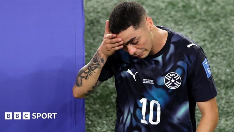 World Cup 2026: Paraguay’s Miguel Almiron sent off for covering mouth while speaking to opponent A picture of the World Cup predictor, with text alongside reading "Predict the World Cup"