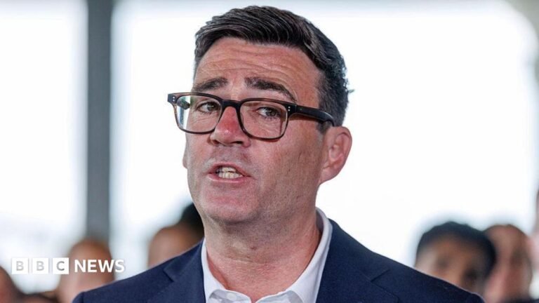 Andy Burnham to scrap digital ID to focus on ‘helping with cost of living’ Andy Burnham in a suit and glasses. A close up of his face.