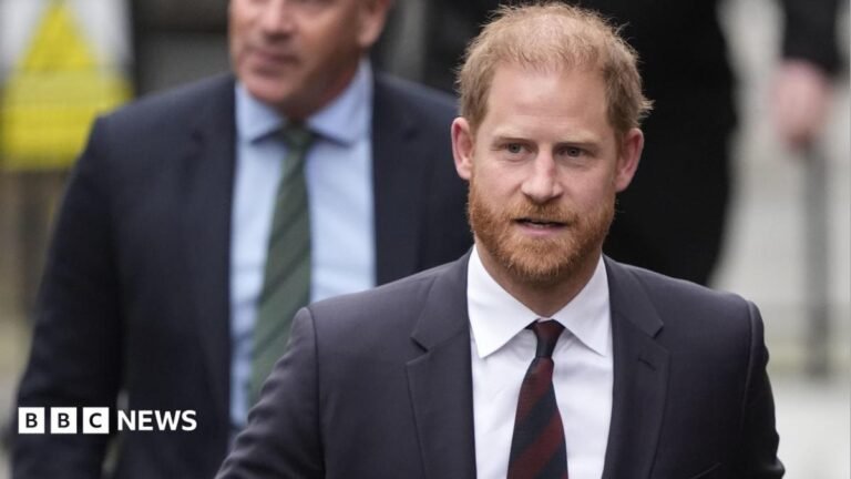 Buckingham Palace says Prince Harry will not stay at palace Prince Harry wearing a dark suit with a maroon tie.