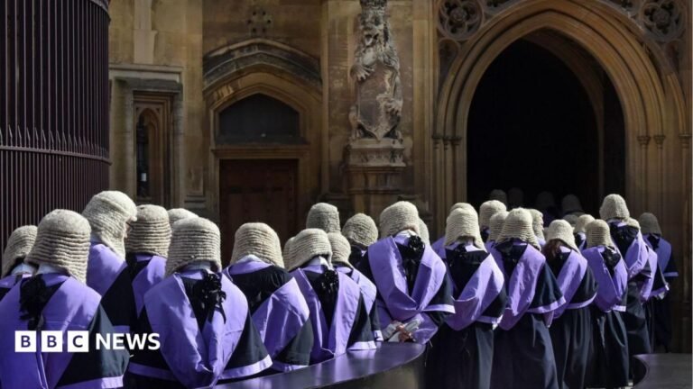 Stock photo of British judges wearing traditional wigs and gowns in procession at Westminster in London in 2017