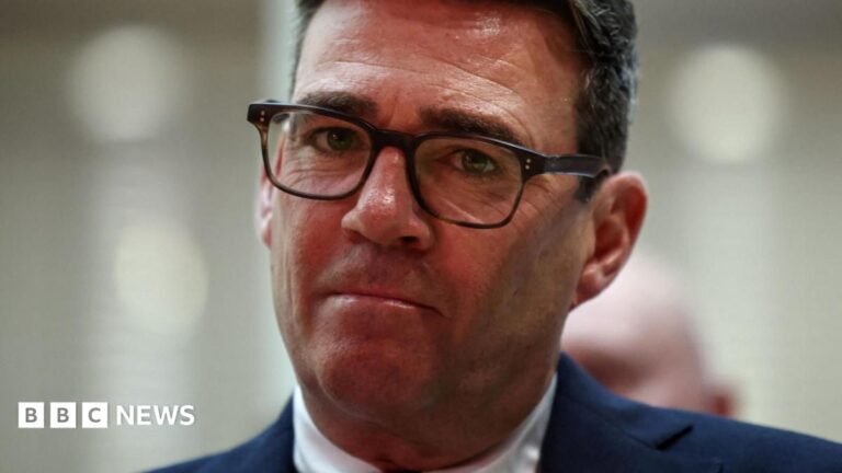 Burnham to announce plans for new North Sea oil and gas drilling Andy Burnham looks directly forward, his lips are purse and he wears tortoise shell glasses. His suit jacket is navy and his shirt is white. The background is blurred grey.