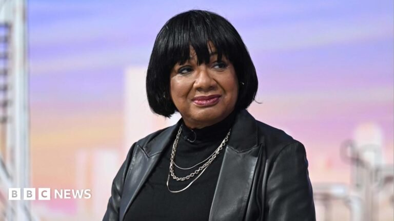 Diane Abbott readmitted into Labour Party after suspension Diane Abbott sitting in the Sunday with Laura Kuenssberg TV studio, wearing a black leather jacket over a black top