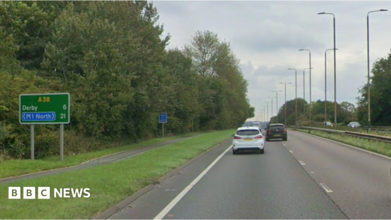 Four people including baby die after car crashes into trees in Derby A woman with short brown hair looks directly into the camera with a slight smiling expression. She is wearing a pink top and a silver necklace with a heart charm.