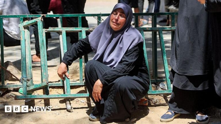 Israeli strike on police post in Gaza kills seven, officials say A woman with dark hair pulled back from her face points to a plaster on her arm