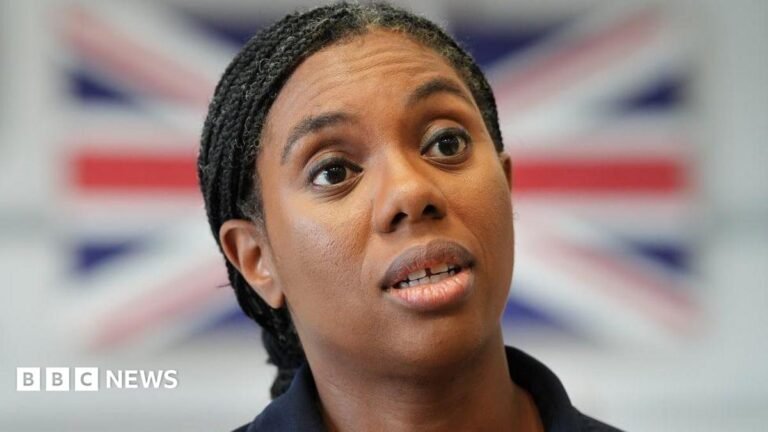 Kemi Badenoch: Andy Burnham is ‘people pleaser’ with ‘airy fairy’ plans Kemi Badenoch speaking, with a blurred Union Jack in the background