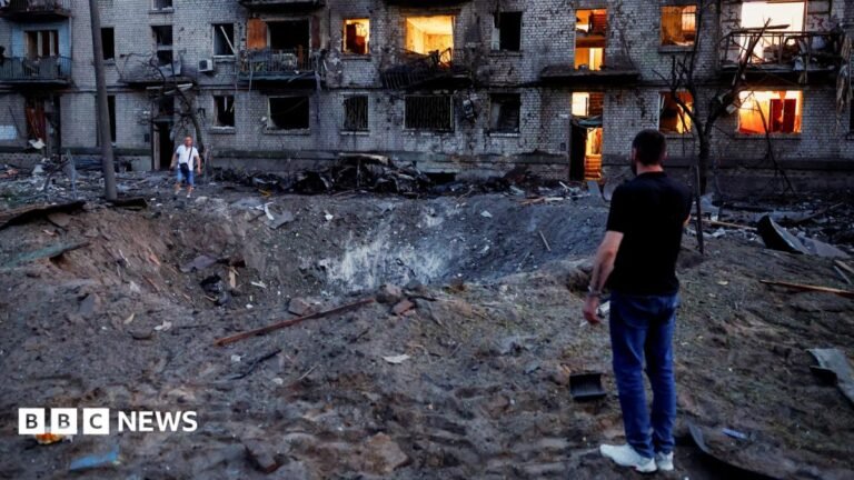 Kyiv comes under major Russian missile and drone fire A woman with shoulder-length blonde hair talks into a microphone