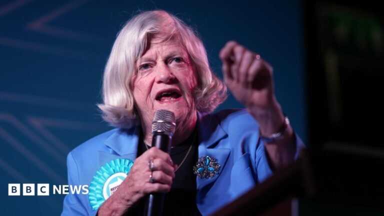 Man arrested on suspicion of murder of Ann Widdecombe, police say Amelia Lord is a white woman in her late 20s. She has shoulder length brown hair partly pulled back in a ponytail with frontpieces either side of her face. She has defined eyebrows and is wearing makeup, has a central nose ring and earrings, and is smiling at the camera. She wears a sleeveless black top. She is holding a pair of books and stands in front of a bookshelf with collections of books on it, including titles by Rebecca Yarros and the Harry Potter series by JK Rowling.
