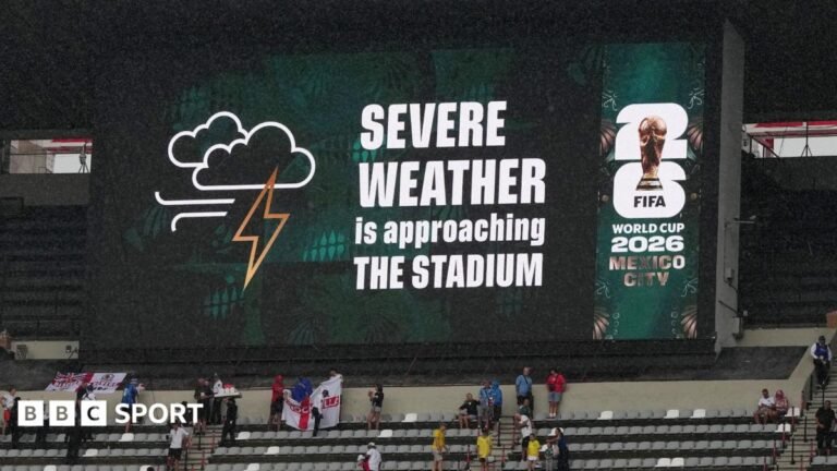 A sign displays 'Severe weather is approaching the stadium' at Mexico City's Azteca Stadium