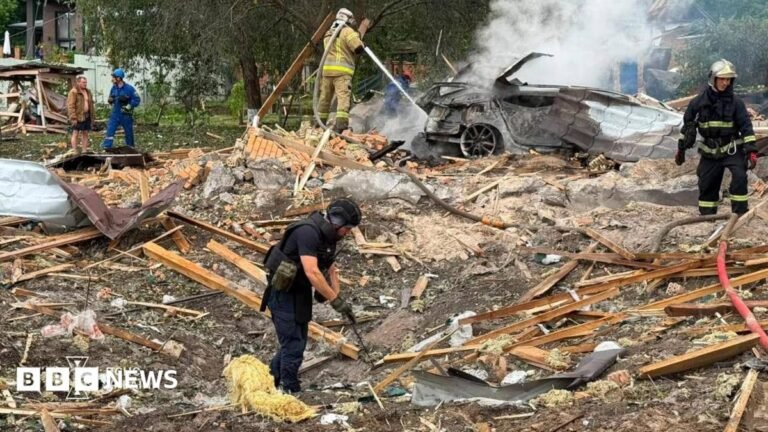 Ten killed in Russian attack on drone exhibition near Kyiv Emergency services clear through the rubble following a Russian missile strike just outside of Kyiv. Firefighters can be seen extinguishing a car fire in the background