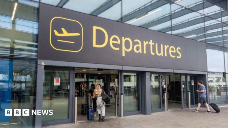 Water supply problem affects both terminals at Gatwick Airport The departures entrance at Gatwick Airport with large yellow "Departures" signage above glass doors. Travellers with luggage can be seen entering the terminal building.