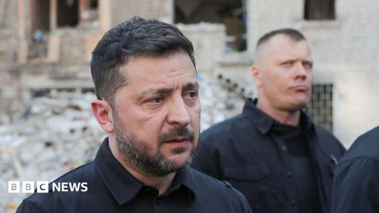 Zelensky to press Nato for air defence systems after intense Russian strikes Man in an orange T-shirt helped from a ruined building by an emergency worker