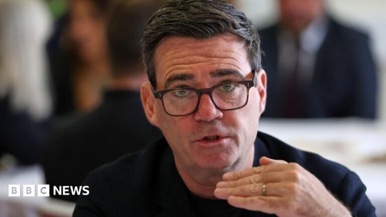 Andy Burnham wearing a black top