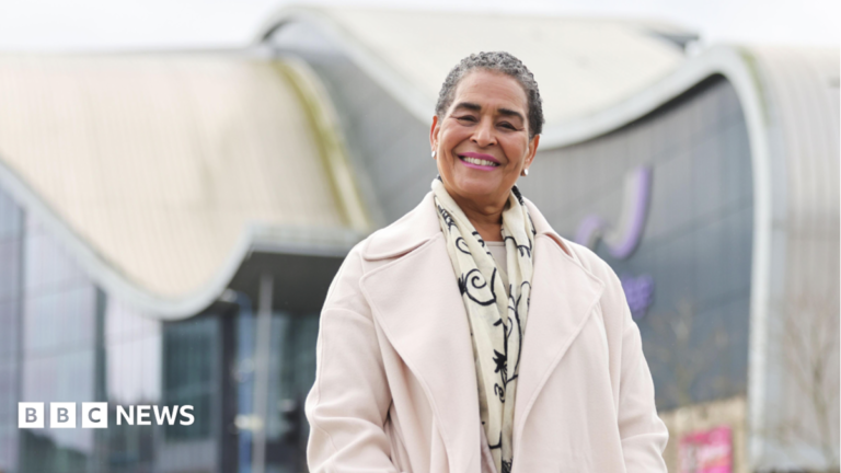 Birmingham Green Party councillor charged with assaulting five people A woman with short dark grey hair, wearing a cream coat and scarf, pictured from the waist up with a glass building behind her.