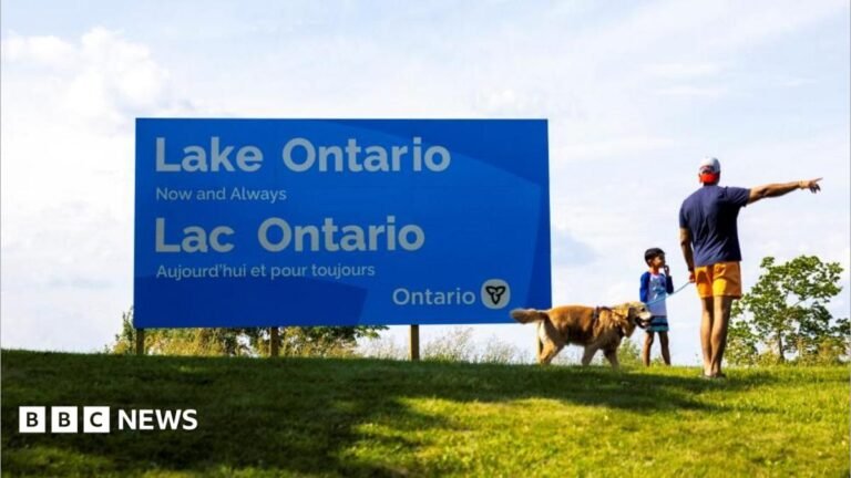 Canada installs large Lake Ontario sign in latest jab at US A family walks by a sign reading "Lake Ontario, Now and Always," unveiled by Ontario Premier Doug Ford at Fifty Point Conservation Area, near Grimsby, Ontario, Canada.