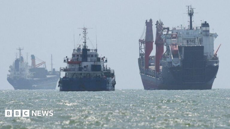 China hits out at ‘illegal’ new US sanctions on Iran and trading partners Archival image - a white plane with a light blue stripe, crashed in a field. Only the partial front end can be seen with debris strewn around.