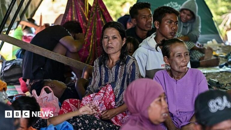Villagers rest in a tent in an open field in East Nusa Tenggara