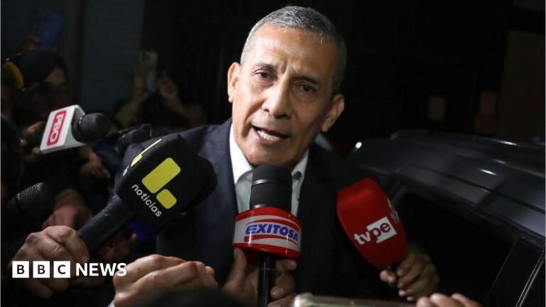 Former Peruvian President Ollanta Humala speaks in front of a number of microphones