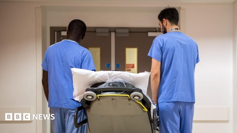 Risk of patient safety ‘bonfire’ with Health Bill changes, Lib Dems say Medical staff walking in a hospital corridor
