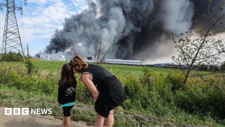 Russia warns UK over supplying drones to Ukraine People watch as smoke rises above a Wildberries facility following a reported Ukrainian drone strike at the Koledino Industrial Park near Podolsk in Russia on 16 August.