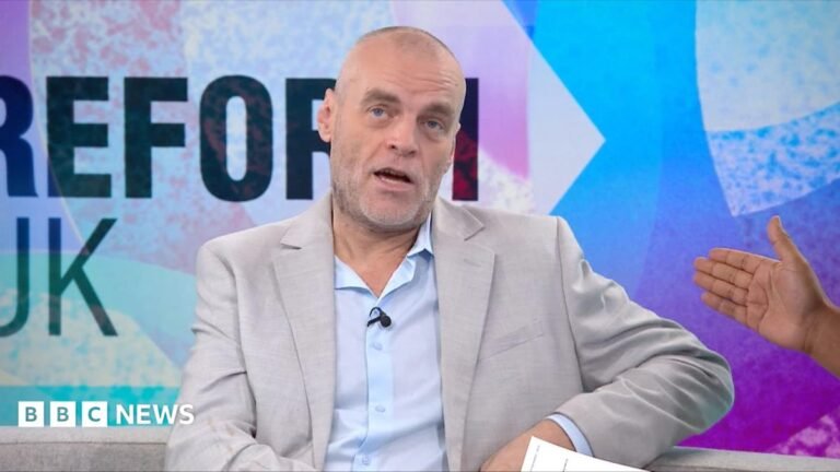 Tim Montgomerie: Suspended Reform UK member vows to fight to remain in party Tim Montgomerie, with short cropped hair and a grey beard, is wearing an open necked shirt and suit jacket. He is in the Newsnight studio