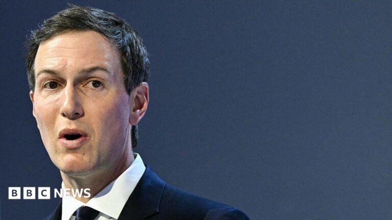 Close up of Jared Kushner, who has short, dark hair and is wearing a dark suit, white shirt and tie.