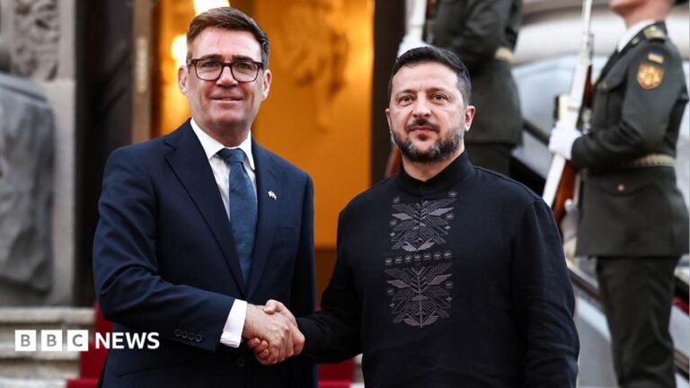 UK drone factories may face attacks from ‘unknown sources’, says former Russian minister Burnham and Zelensky pose looking at the camera while shaking hands with soldiers behind them, on the steps of Horodetskyi House in Kyiv on Monday.