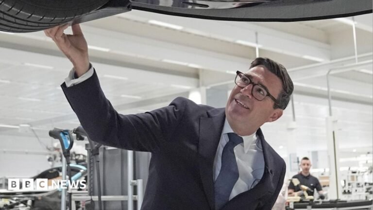 Andy Burnham rejects ‘tax and spend socialist’ comments Prime Minister Andy Burnham looks at a car on the production line during a visit