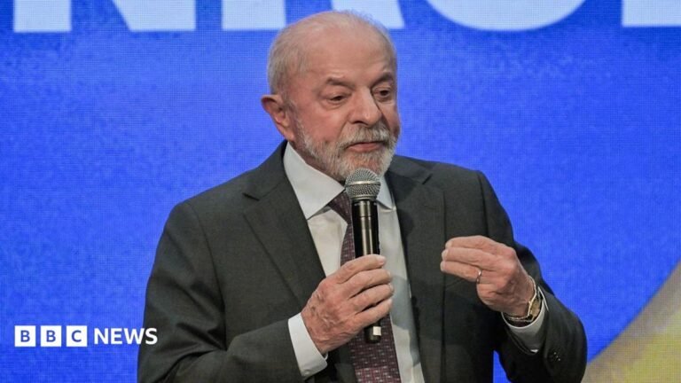 Brazil’s Lula bans online gambling ahead of presidential election Brazil's President and candidate Luiz Inácio Lula da Silva sitting in front of a computerised screen while wearing a grey suit and purple tie.