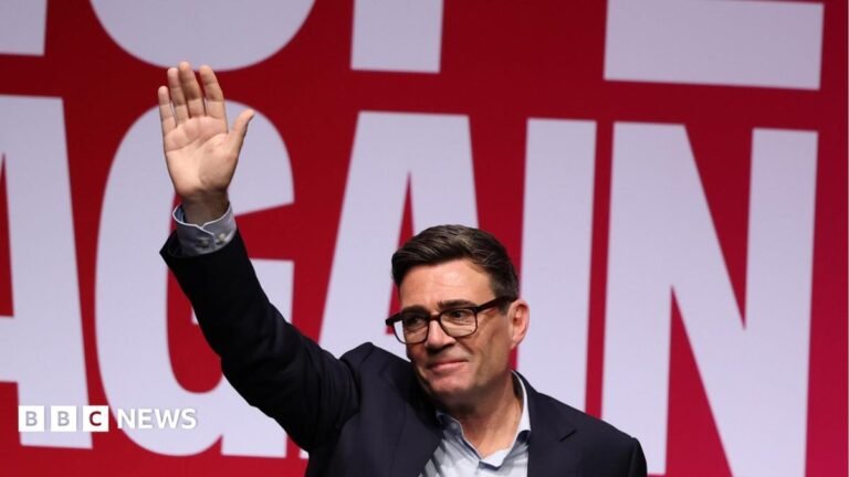Five takeaways from Andy Burnham’s Labour conference speech Andy Burnham waves to the audience in Liverpool against a "Hope Again" banner in the background
