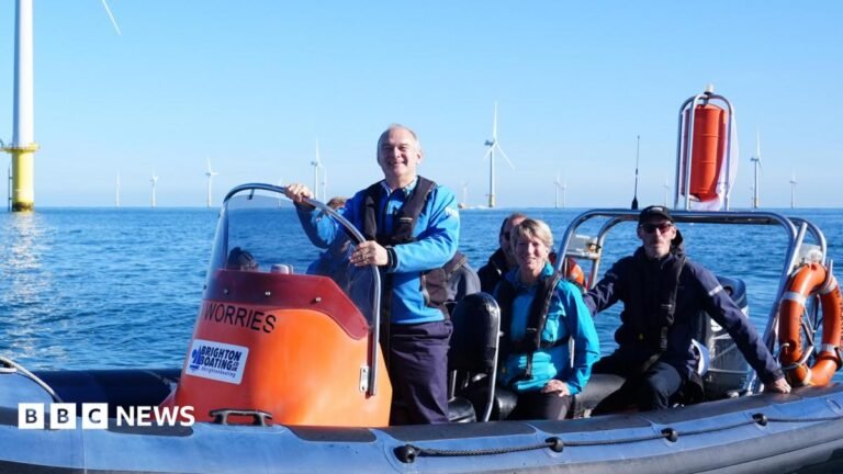 I’ve got no ceiling on Lib Dem ambitions, says leader Ed Davey Liberal Democrat leader Sir Ed Davey and the party's energy spokesperson Pippa Heylings in a speedboat during a visit to Rampion Windfarm during the Liberal Democrat Party conference in Brighton. Behind their orange speedboat is a windfarm, set against a blue sky.