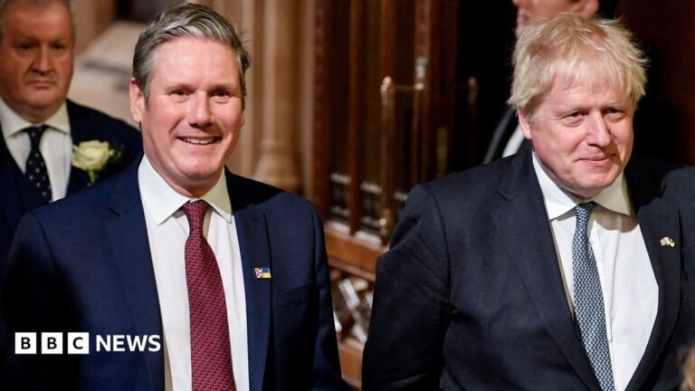 Keir Starmer, Boris Johnson: Why are they on the Chiltern Hundreds list? Keir Starmer on the left, and Boris Johnson on the right, walking together in the Houses of Parliament in 2024. They are smiling and both wear white shirts, a lightly patterned tie, and blue suit jackets.