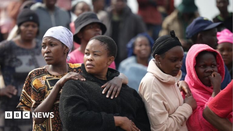 Kempton Park killings: Ninth woman’s body found in South Africa’s Dawn Park Members of the South African Police Service Forensic Pathology Services dressed in white protective gears work on a crime scene with police with their car nearby