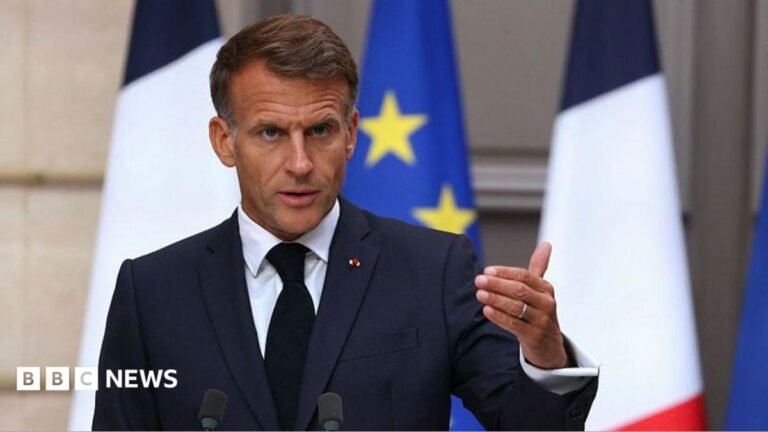 Russian hybrid attacks against Europe intensifying, says Macron Earl Spencer walking, wearing a navy suit and a purple tie.