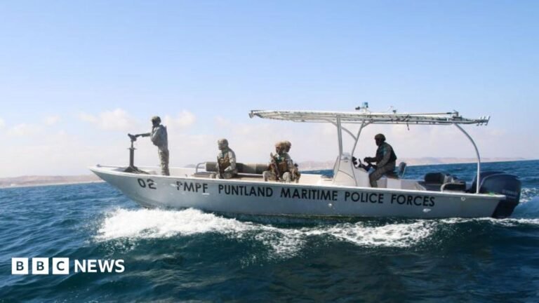 Somali pirates killed tanker crew before rescue, Puntland official tells BBC An image of small, white motorboat with the words "PUNTLAND MARITIME POLICE FORCES" written on its side, carrying several uniformed personnel as it speeds through deep blue ocean waters.