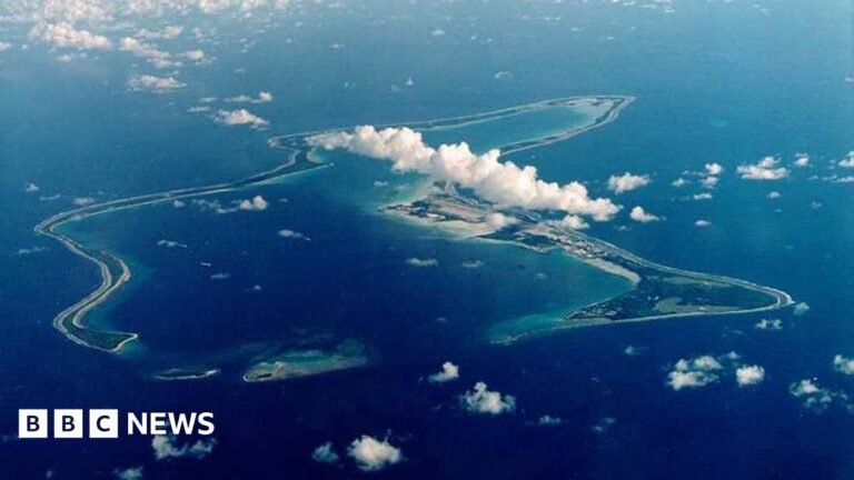 UK to review Chagos Islands deal over lack of US support, Streeting tells BBC A bird's eye view of the Chagos Islands – officially known as the British Indian Ocean Territory – in the Indian Ocean, with white clouds in the sky.