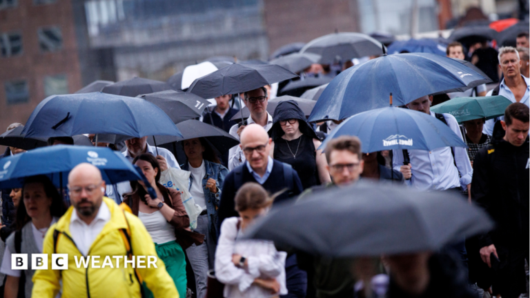 UK weather: Drought and hosepipe bans remain despite wettest week since early February Commuters walking in the rain with umbrellas up