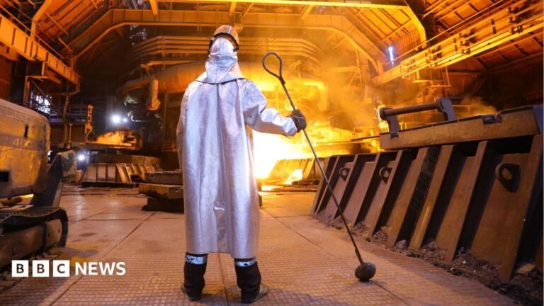 Ukraine’s prized steel industry left in ruins by Russian missile campaign A man in a silver cloak stands near a blazing furnace holding a metal prod