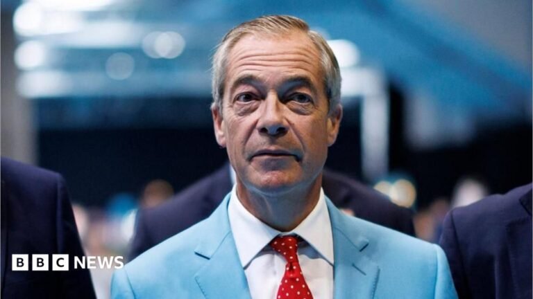 Will record donations to Reform be a moment of political change? Reform UK leader Nigel Farage is wear a turquoise-coloured suit jacket, white shirt and a red tie with white dots.