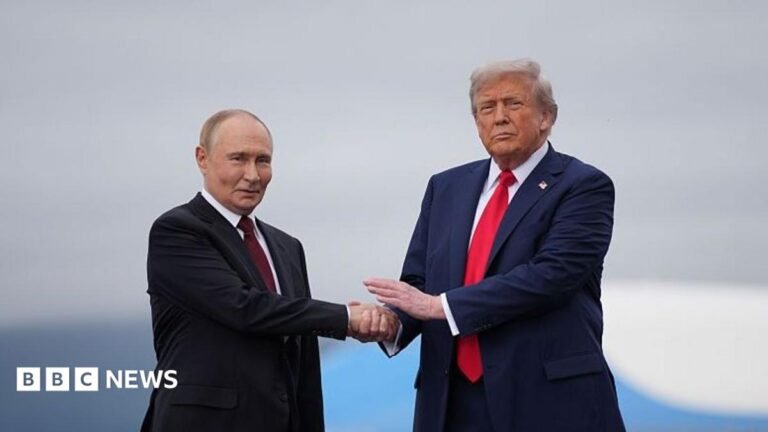 Analysis: Trump’s global headaches worsen weeks before midterms Lower half of a workman standing on a roof with a chimney visible. Some tiles are not yet laid on the roof structure.