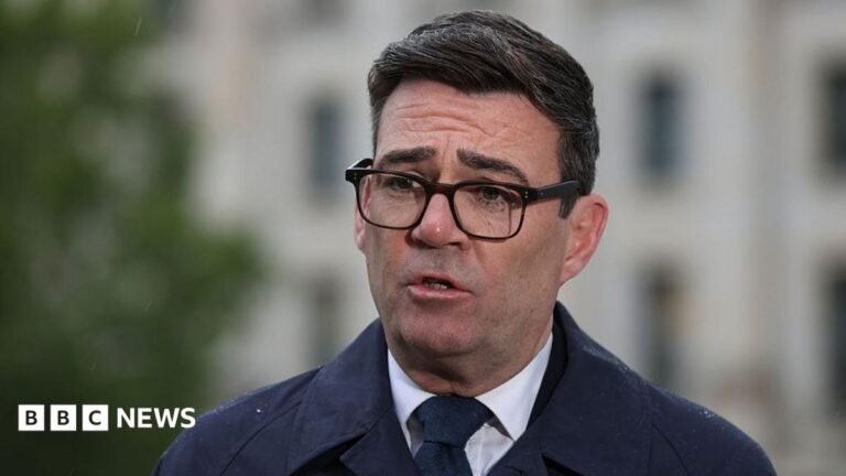 Burnham calls on Polanski to reverse Green Party’s Zionism motion Andy Burnham, wearing a dark suit, recording a media interview in Berlin