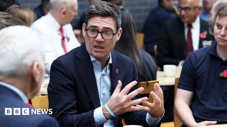 Burnham says he wants to cut welfare bill ‘as soon as we possibly can’ Andy Burnham sitting at an event in Derby with Chancellor John Healey in the background
