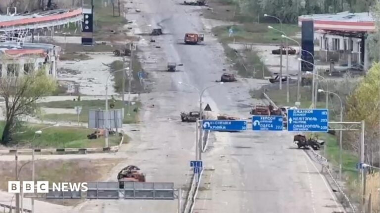 A still image taken from an undated drone video released September 24, 2026, shows destroyed vehicles sitting on a street in Oleshky, Kherson Region, Russian-controlled Ukraine.