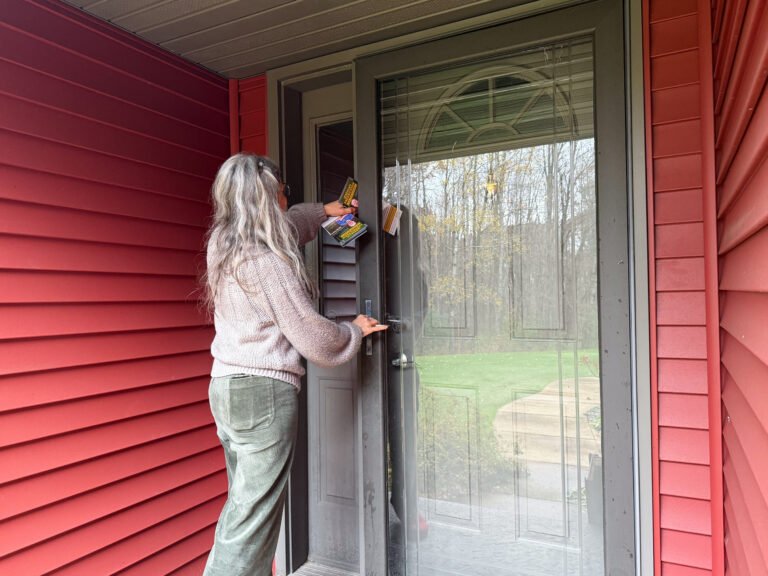 Volunteer Clara Serrano knocks on doors for Rebecca Cooke and Jeremiah Fredrickson, who’s running to flip a Wisconsin state assembly seat.