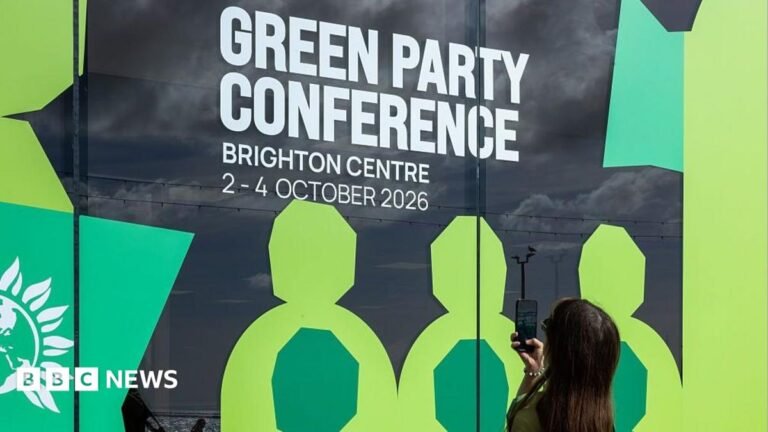 Green Party members back ‘Zionism is racism’ conference motion A woman takes a photo of sign advertising the Green Party conference.